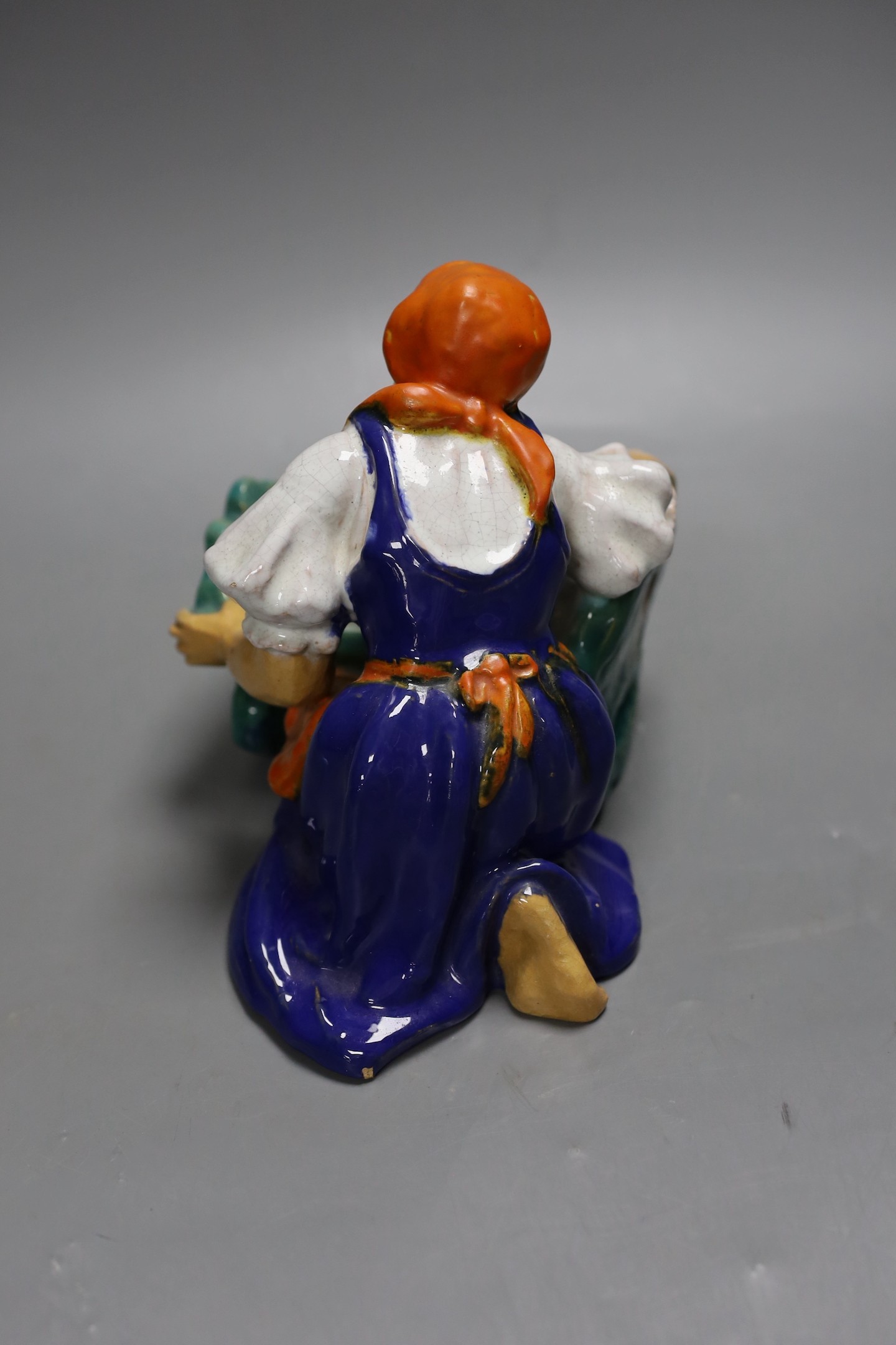 A Czech pottery figure group, 15cm